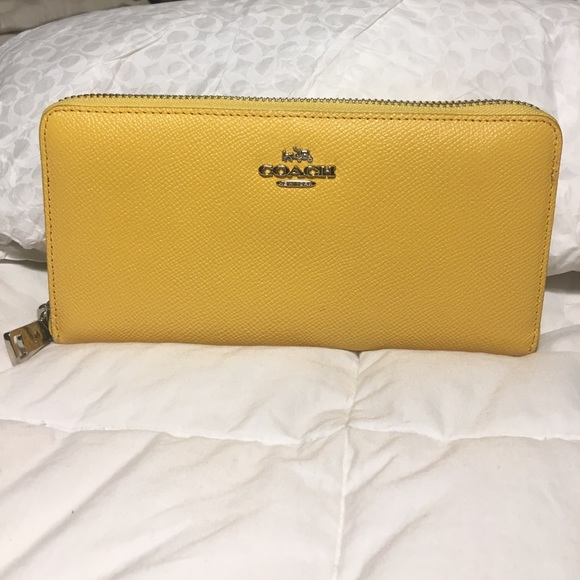 Coach Handbags - Authentic Coach brand yellow all leather wallet